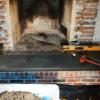 Old fireplace brick facade and hearth stone removed 